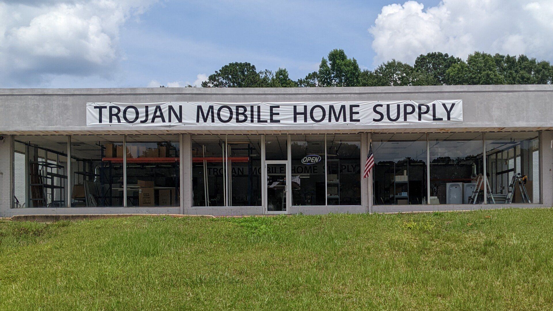storefront tinting AL - the store climate could be controlled by the AC cooling unit. Due to the Solar heat pounding through glass windows at Trojan Supply in AL.