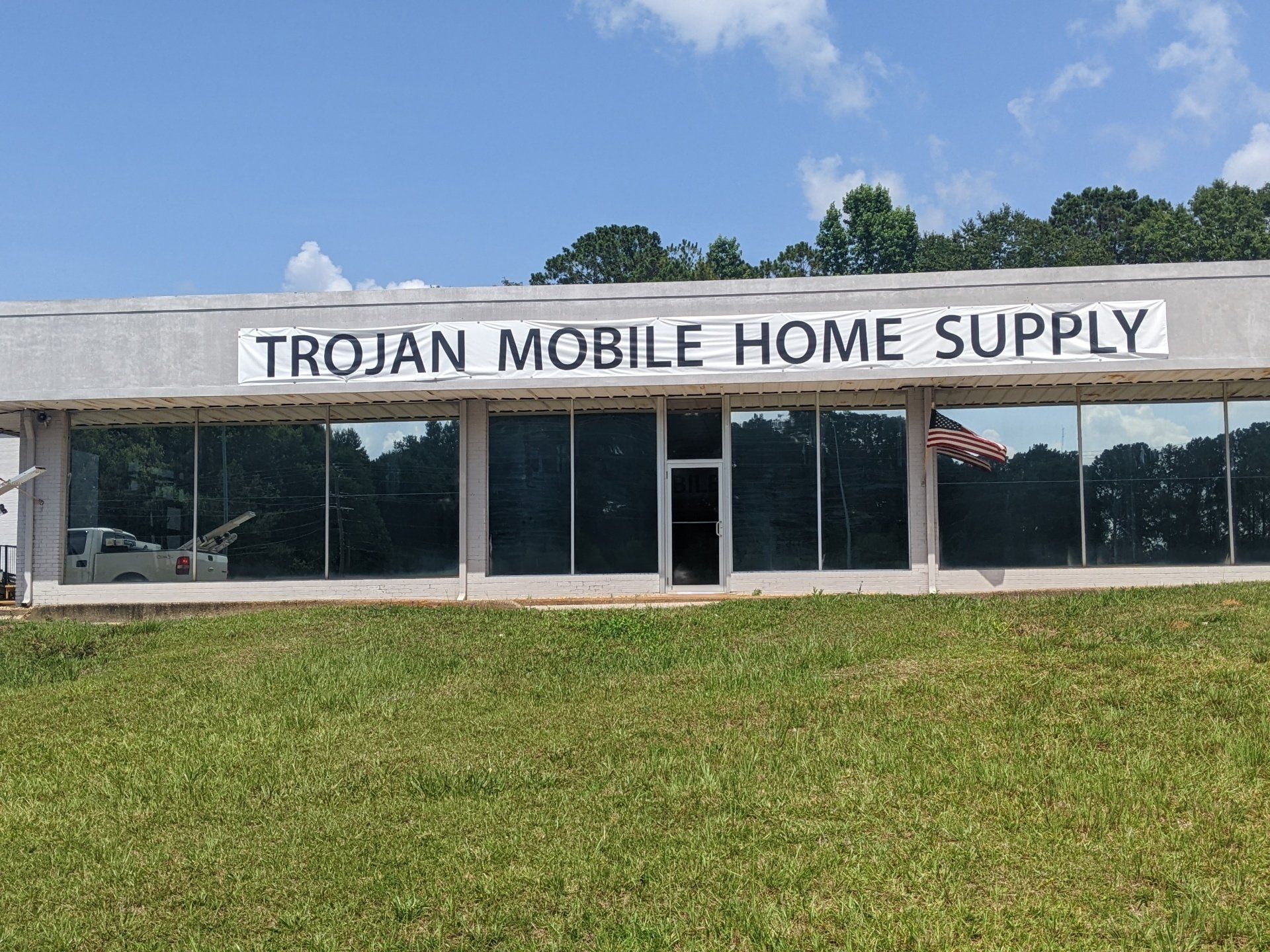 window tinting in AL - Now the heat transfer has been stopped along with UV damage. After SPF ULTRA Tint shielded the glass windows at Trojan Supply in Troy, AL