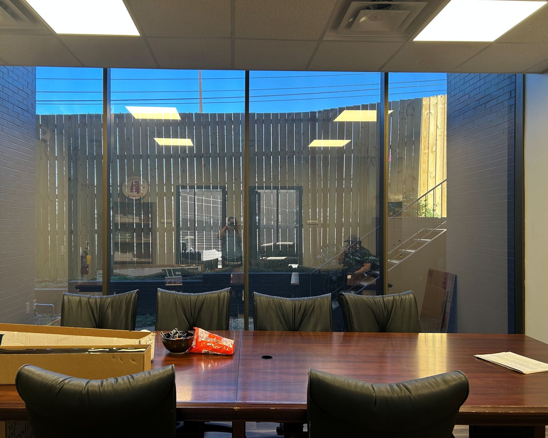 window tinting Montgomery AL - SPF Plus Tint effectively blocks bright Sun glare inside meeting room windows in Montgomery AL