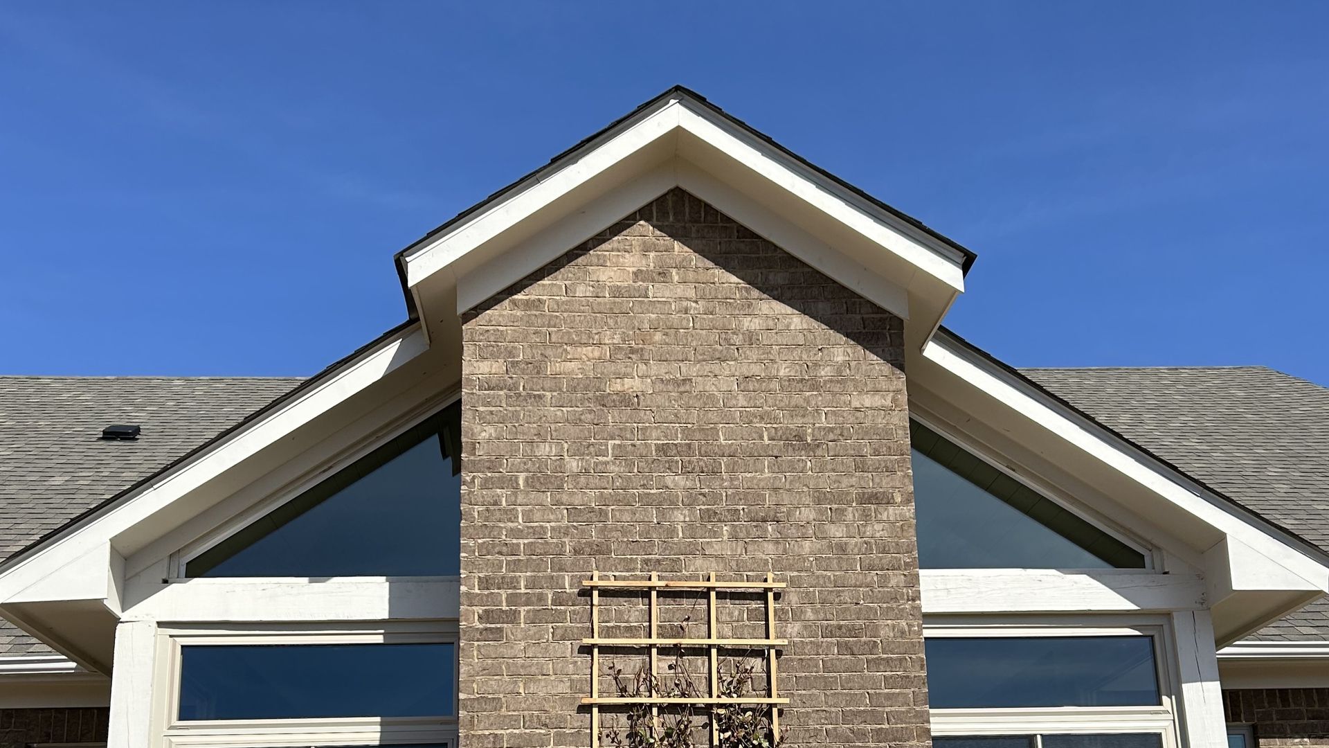 Transom windows shown Before SPF Supreme View Tint cut heat with bright UV Sun from home windows in Opelika AL