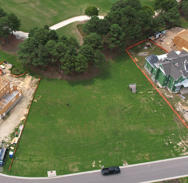 A white house with a screened in porch and stairs