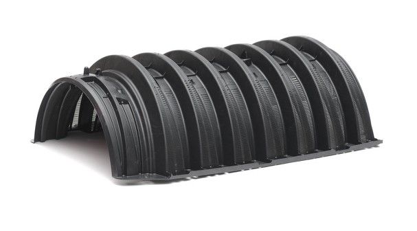 Black corrugated plastic arch-shaped drainage structure.