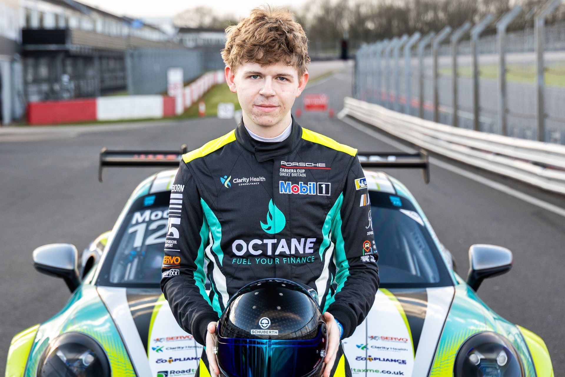 Jonny Moore Motorsport Jonny Moore sitting on  porsche carrera cup