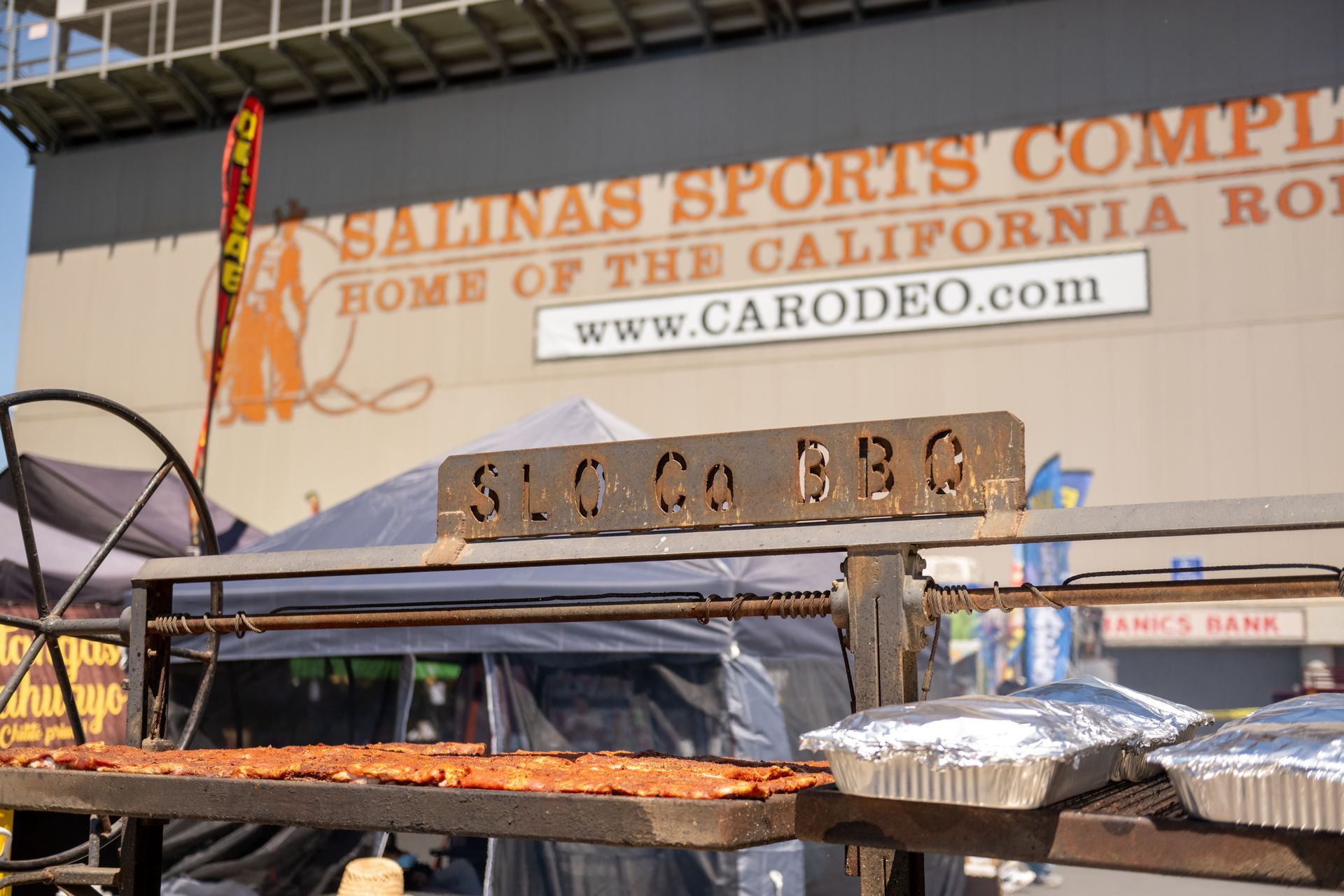 Salinas sports complex sign above a shaded outdoor concession stand on a sunny day