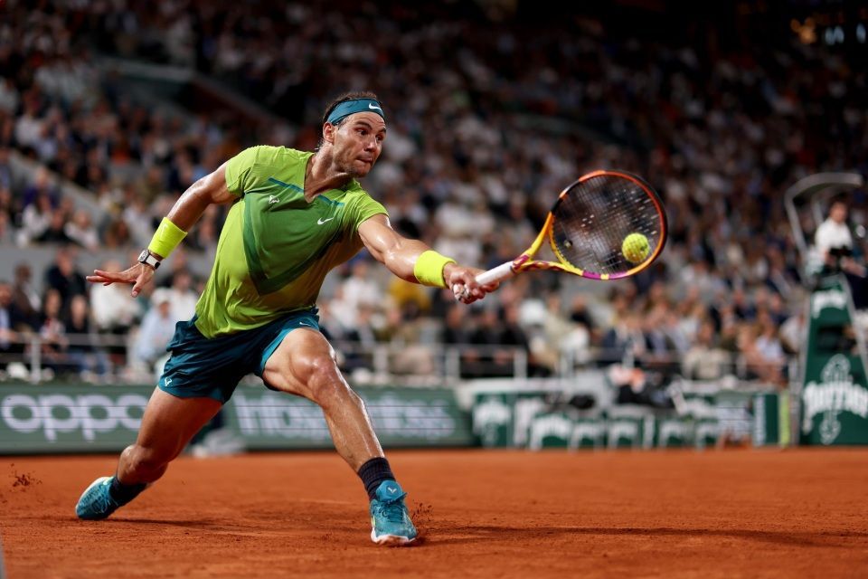 Guy playing tennis