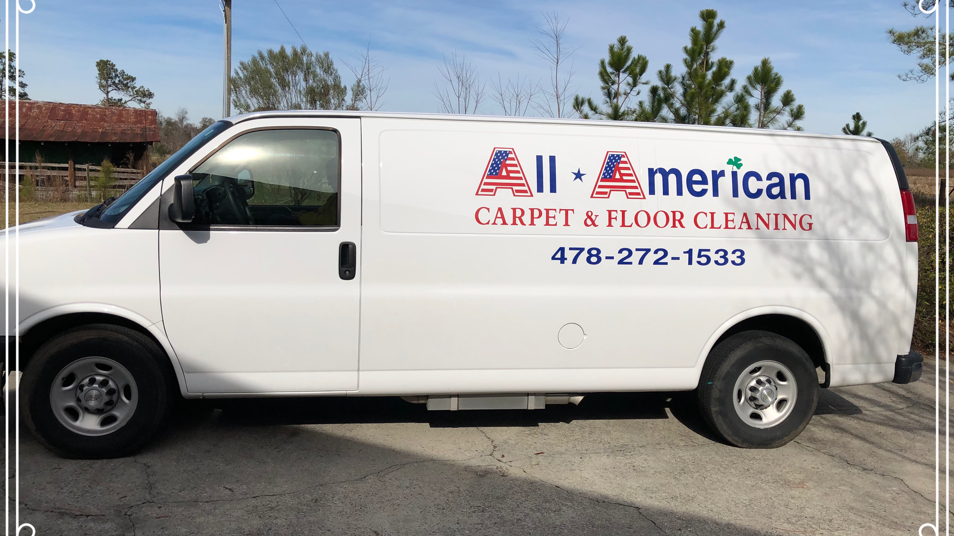 White All American Carpet & Floor Cleaning van with logo and phone number parked outdoors.