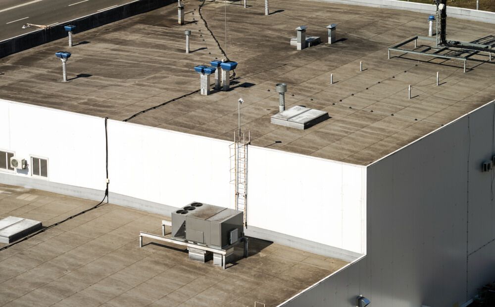 Aerial View of Large Building Roof with Air Conditioning Unit — Refrigerated Technologies (QLD) Pty Ltd In Proserpine, QLD