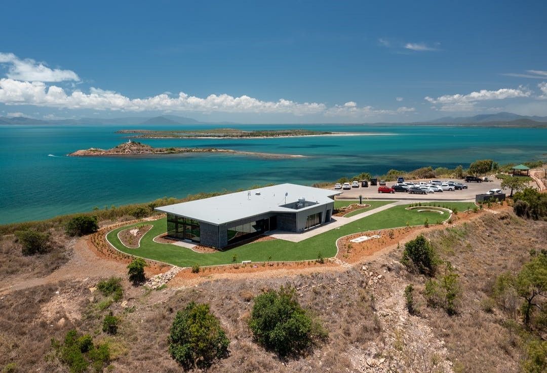 An Aerial View of a House on a Hill Overlooking the Ocean — Refrigerated Technologies (QLD) Pty Ltd In Bowen, QLD