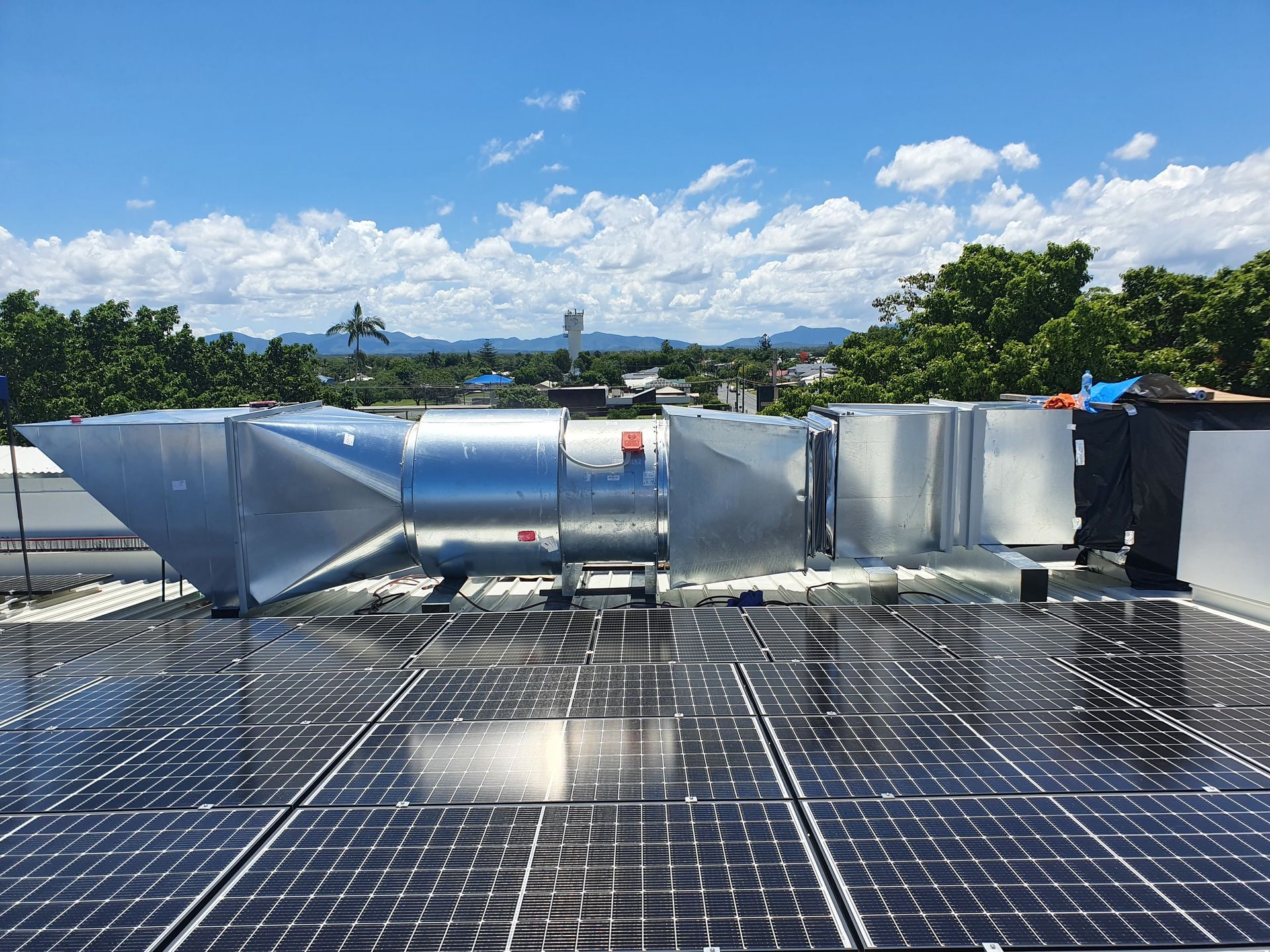 A Roof With a Lot of Solar Panels and a Fan on It — Refrigerated Technologies (QLD) Pty Ltd In Bowen, QLD