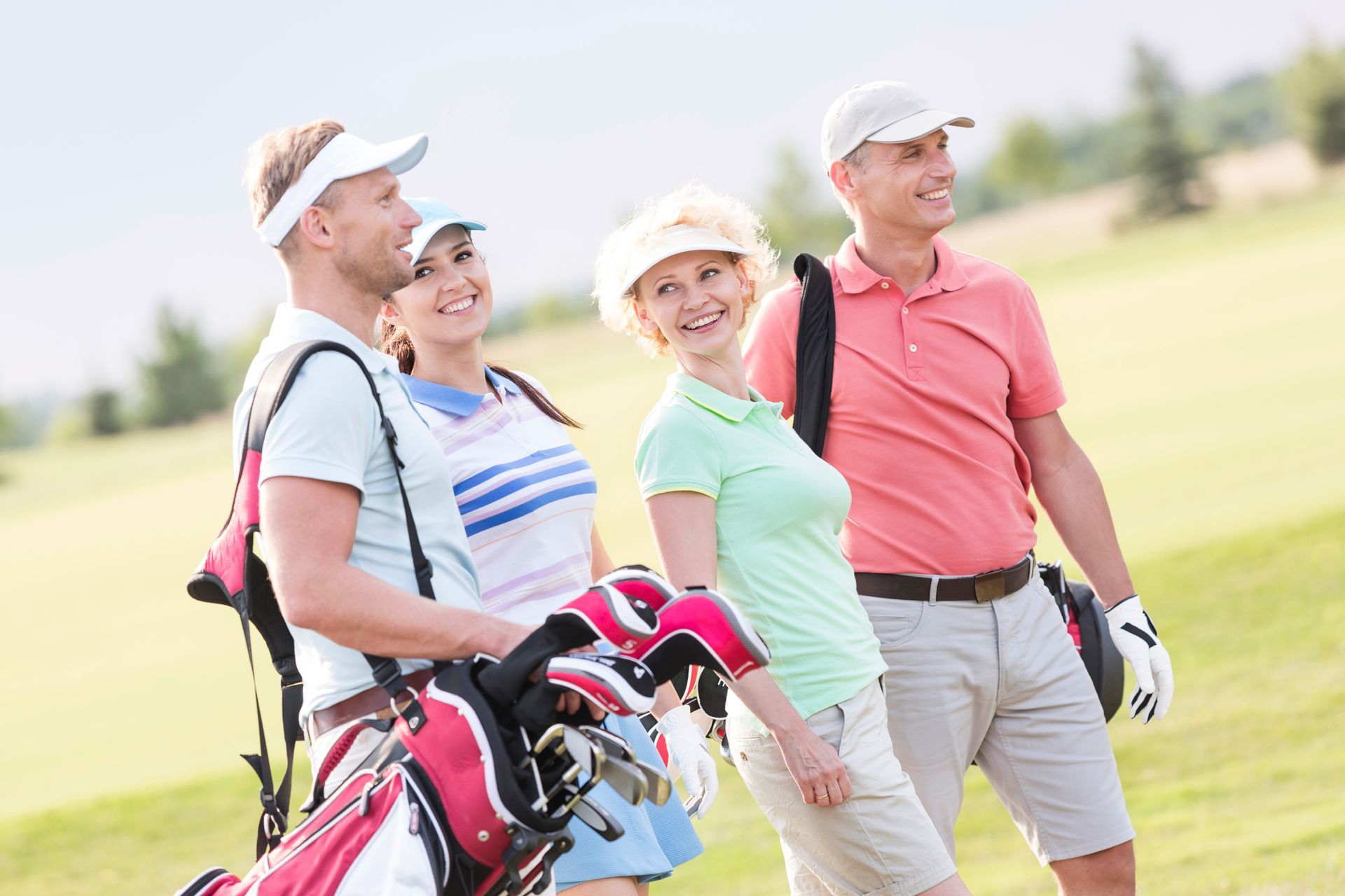 A group of people about to play golf.