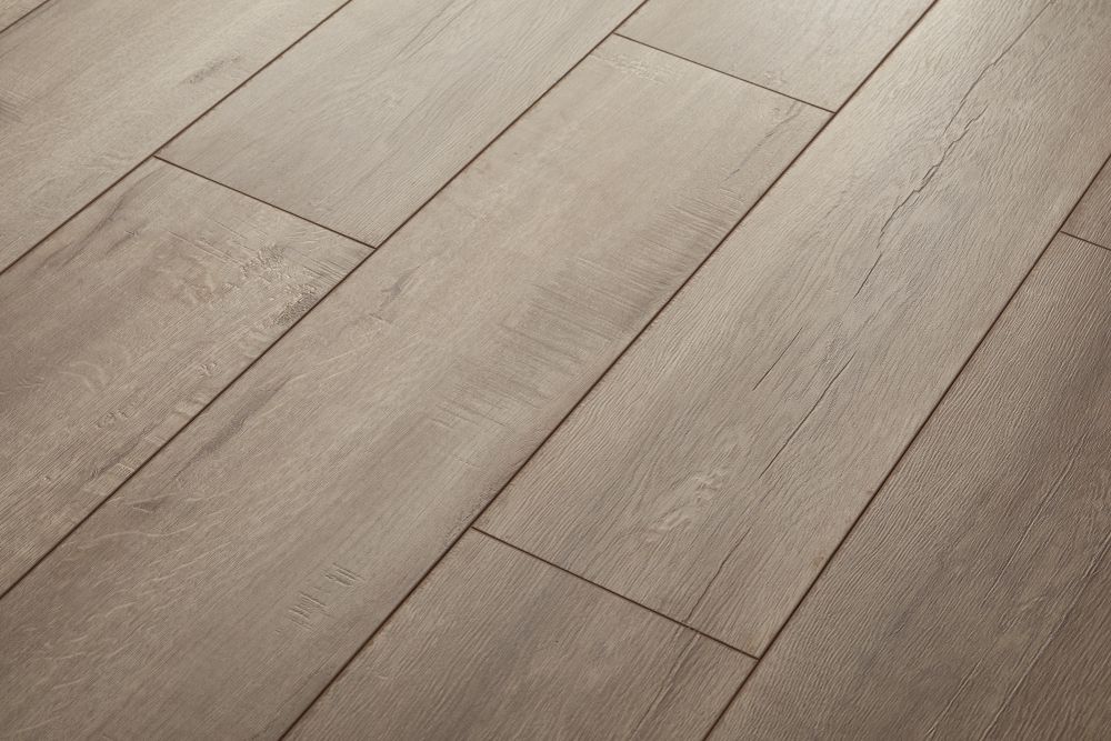 Light wood plank flooring with diagonal grain and subtle seams