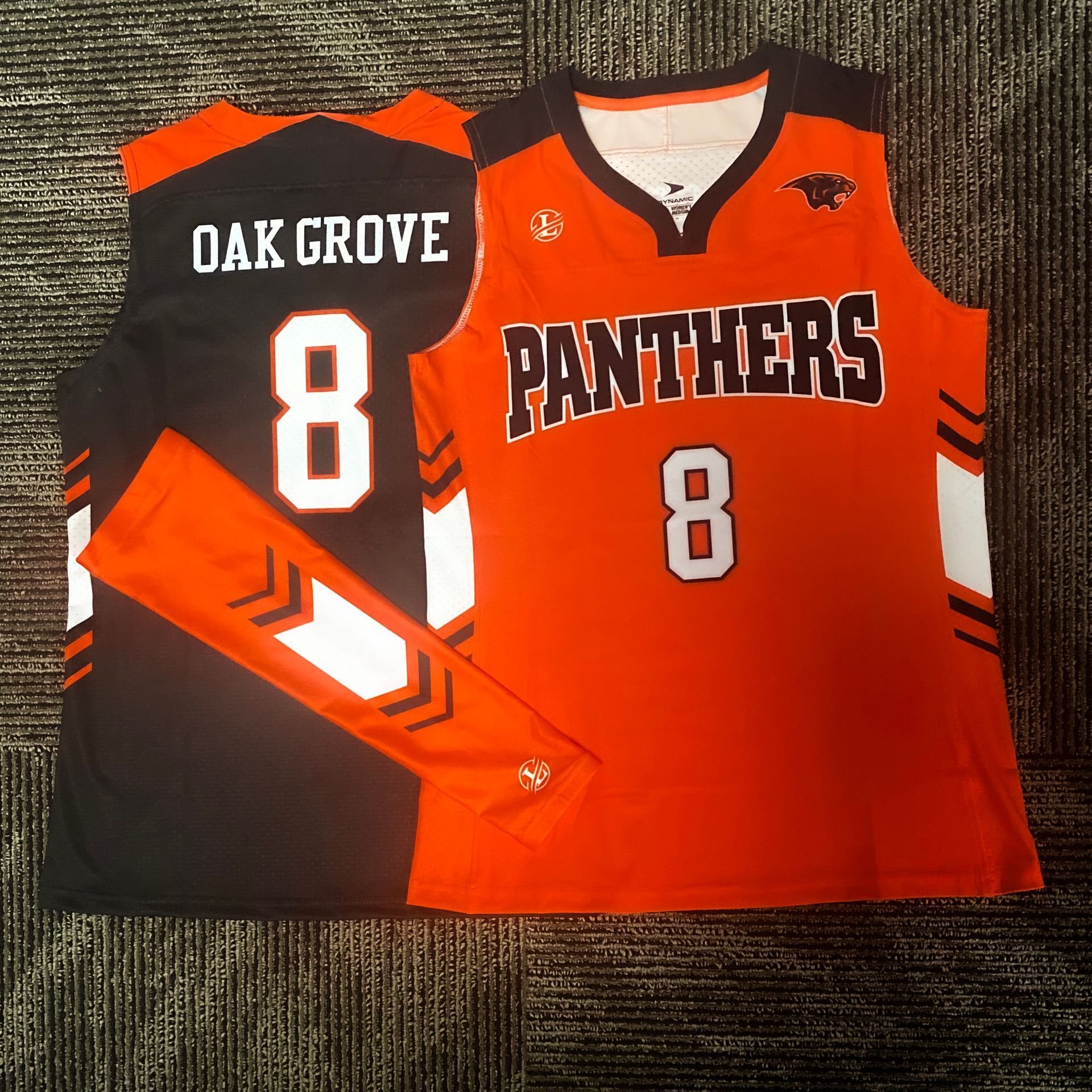Oak Grove Panthers orange and black volleyball jerseys with number 8, front and back view