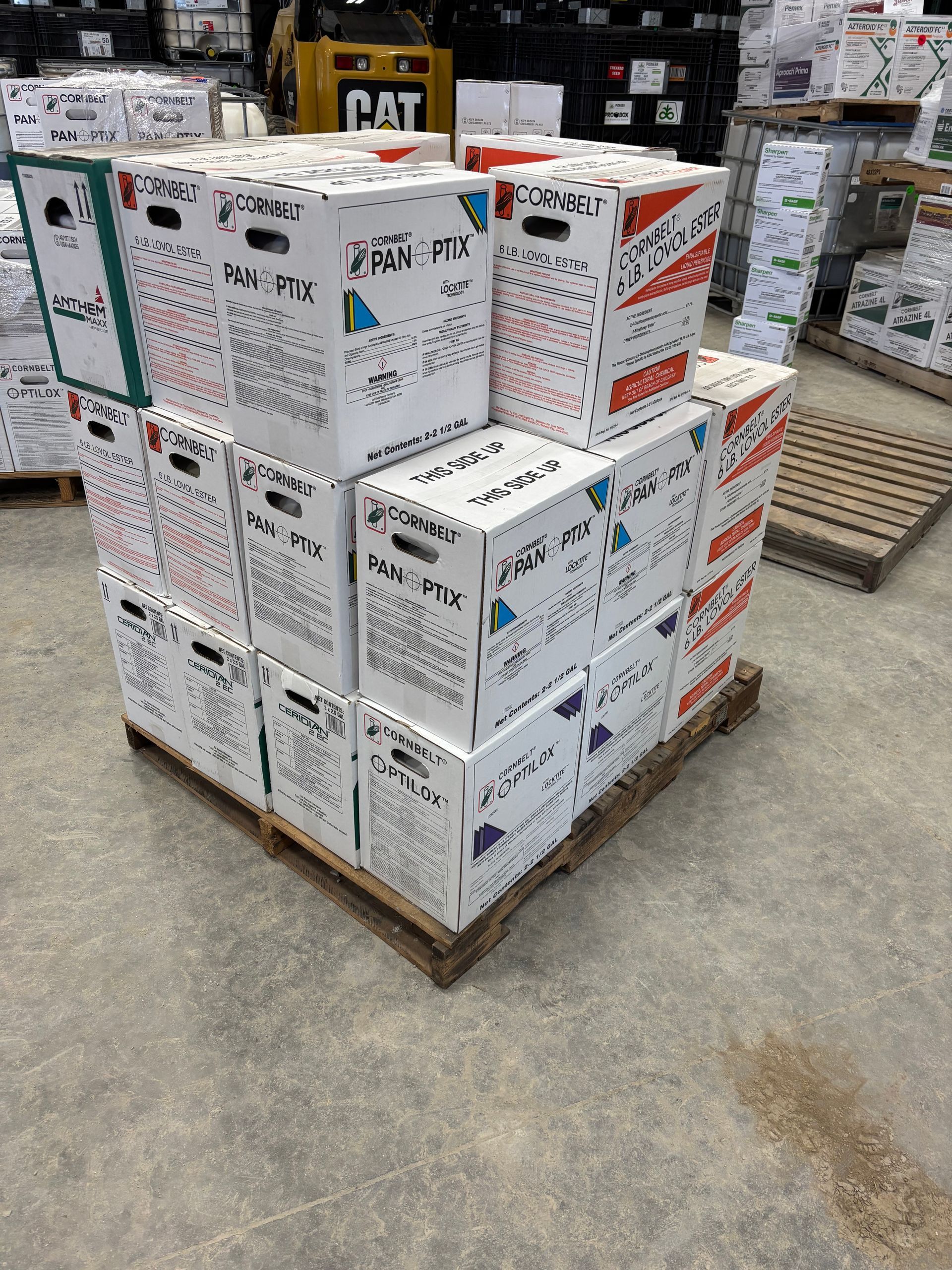 A pallet of stacked, white boxes labeled 