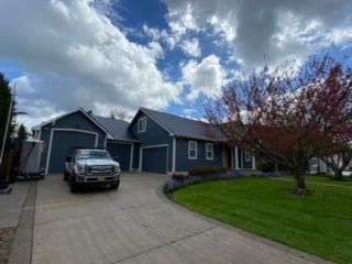 Residential property with a parked truck - Springfield, OR - McKenzie Roofing Inc.