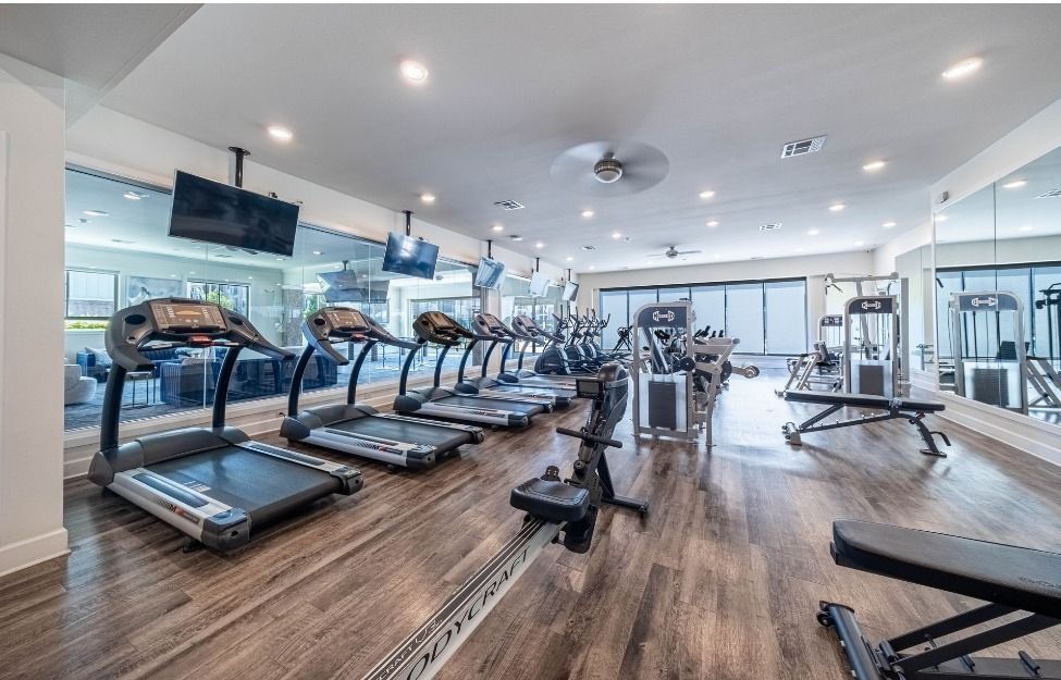 exercise room at watercolors of centerton apartments