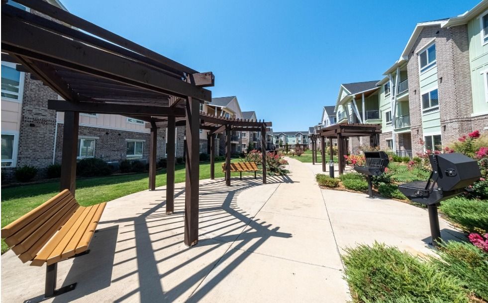 outdoor walkway at watercolors of centerton apartments