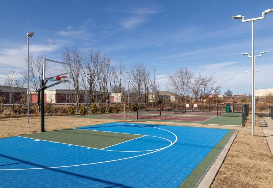 outdoor basketball court at watercolors of centerton apartments