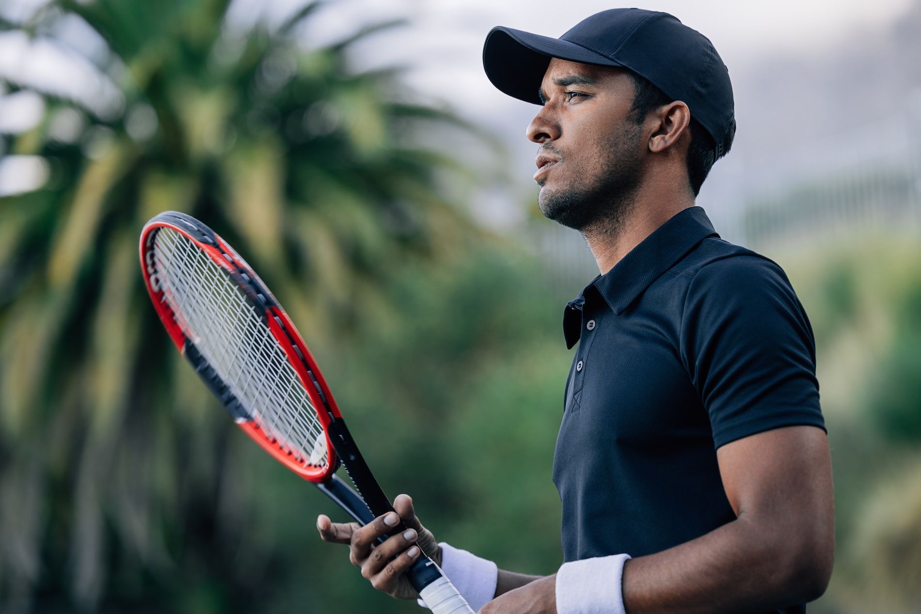 Tennis athlete using mental performance coaching to improve focus confidence and resilience under pressure