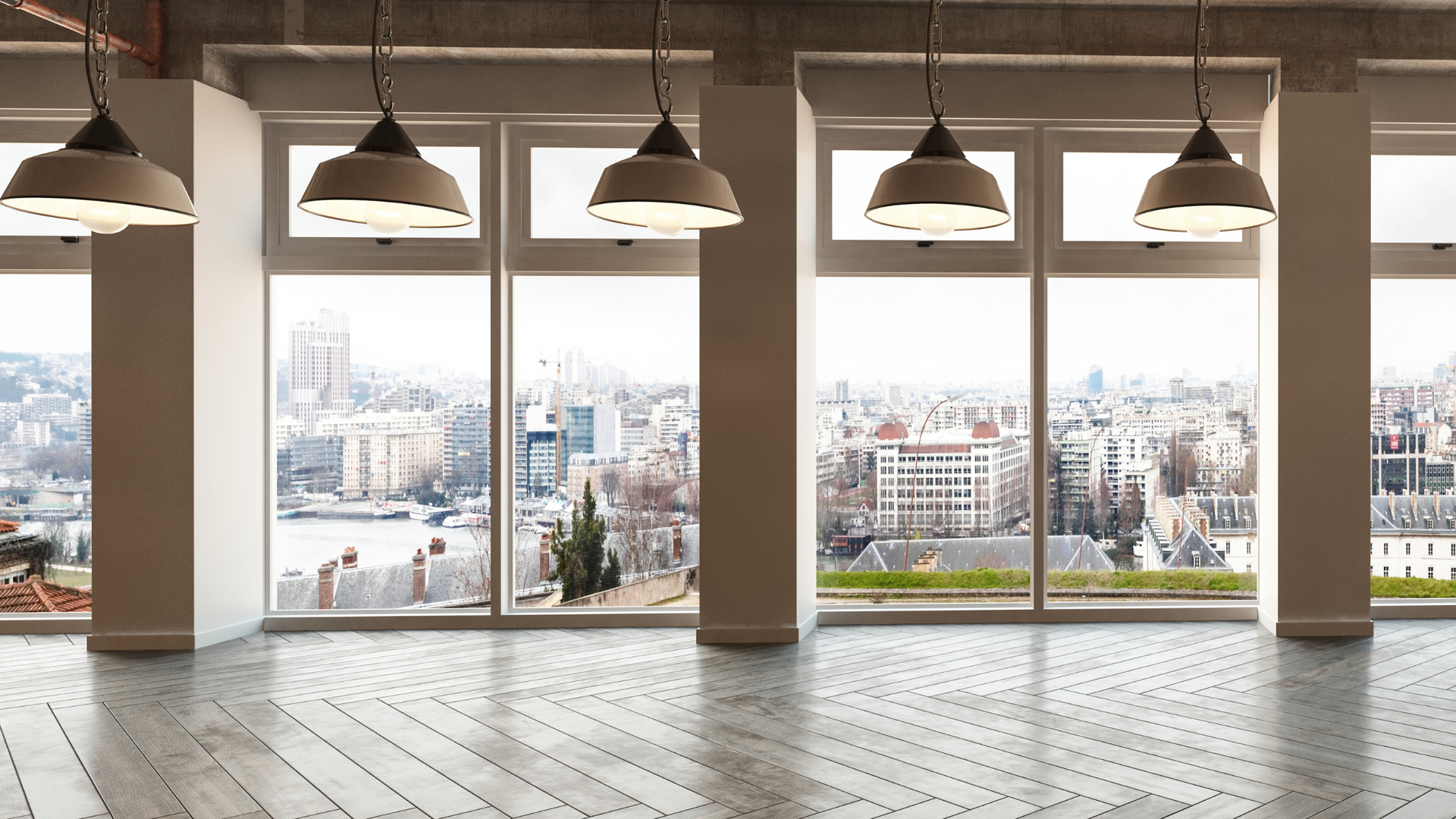 there are a lot of windows in this room with a view of the city.
