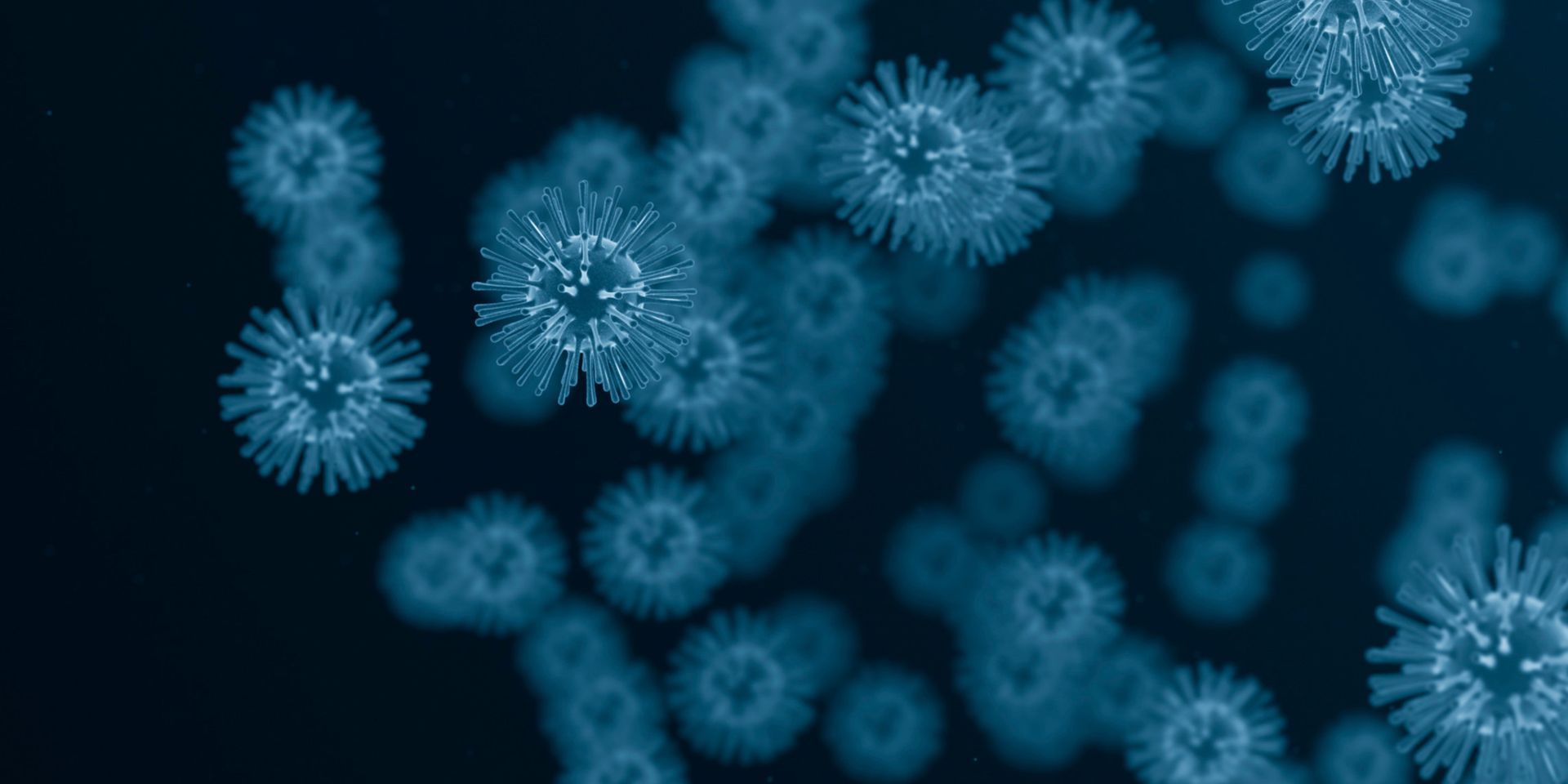 A close up of a virus on a dark blue background.