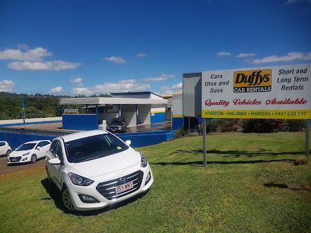 A White Car is Parked in Front of a Car Rental Business — Duffys Car Rentals in Atherton, QLD