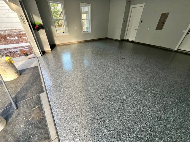 Milltown, WI lake home garage with finished floor