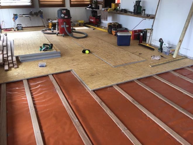 A room with a wooden floor and tools on it