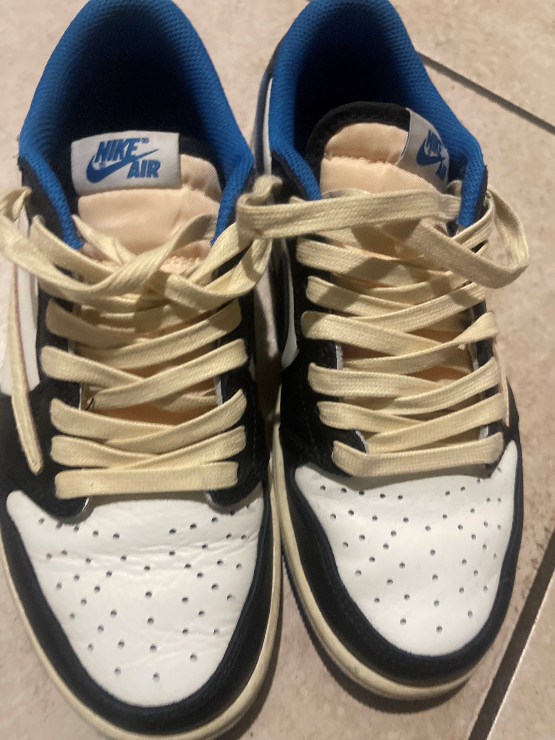 A pair of nike air shoes with white laces