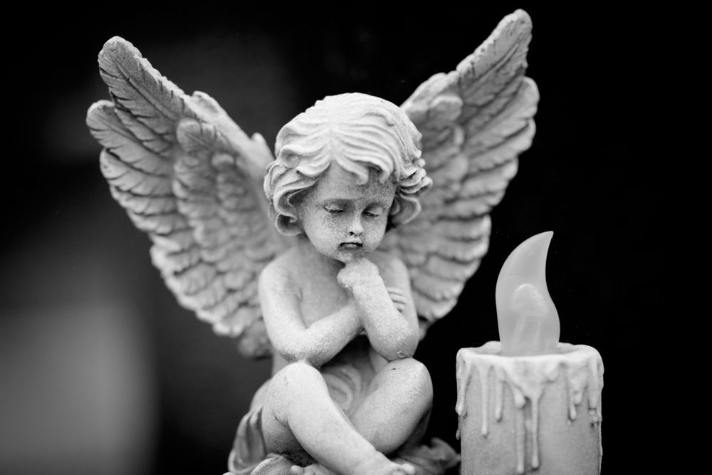 Statue Of An Angel And Candle — Northern Rivers Headstones in Kyogle, NSW