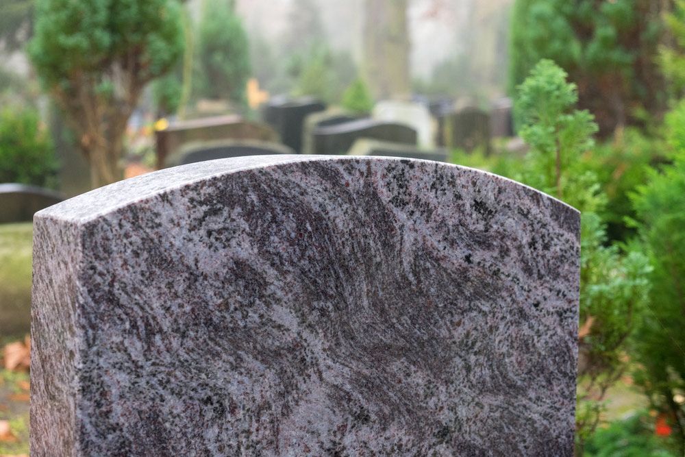 Gravestone In A Cemetery With Trees — Northern Rivers Headstones in Tenterfield, NSW