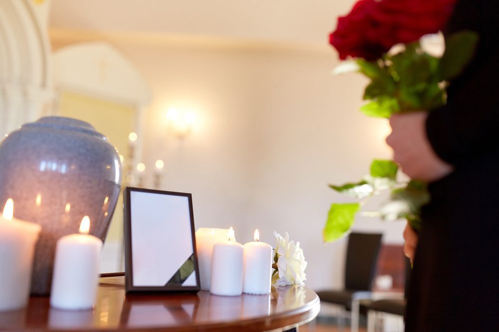 Candles And Urn On The Table — Northern Rivers Headstones in Evans Head, NSW