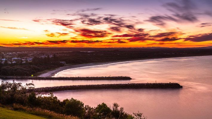 An Aerial View Of A Sunset Over A River — Northern Rivers Headstones in Evans Head, NSW