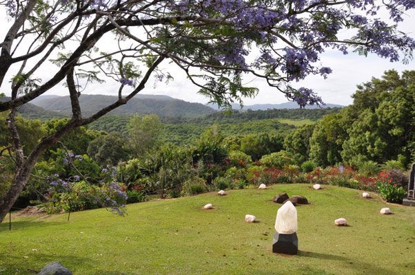 Lush Green Field With Mountains — Northern Rivers Headstones in Mullumbimby, NSW