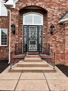 Brick entrance with iron security door
