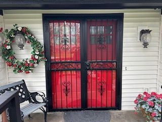 Double red doors with security bars
