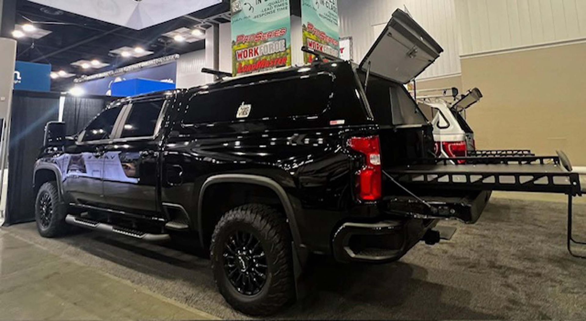 Truck with camper shell, pull-out bed