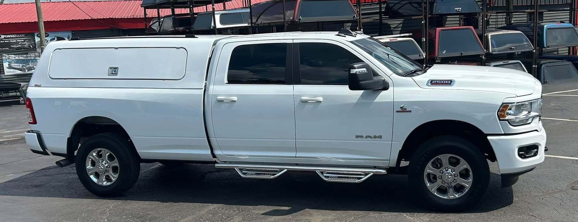 White pickup truck with camper shell