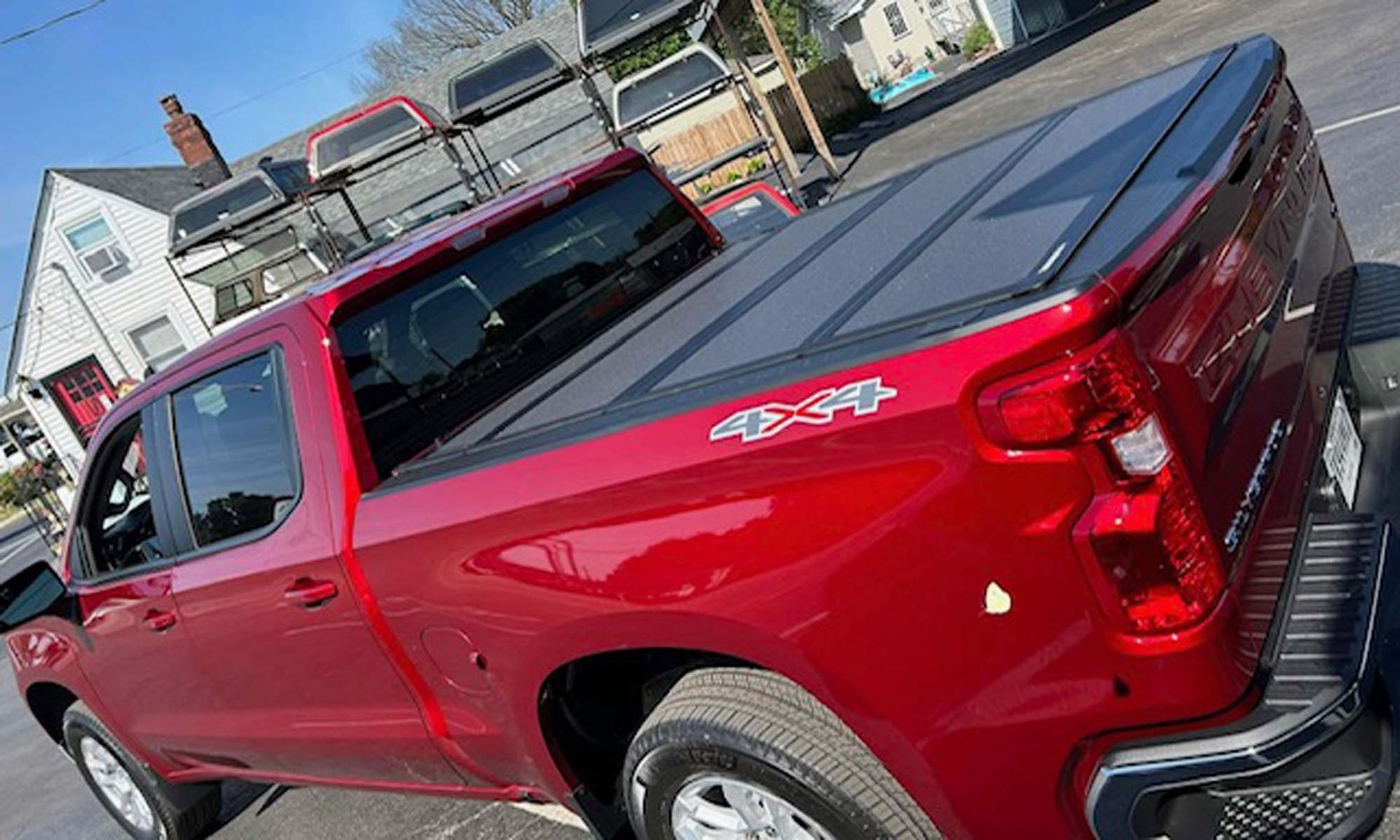 Red pickup truck with black bed cover