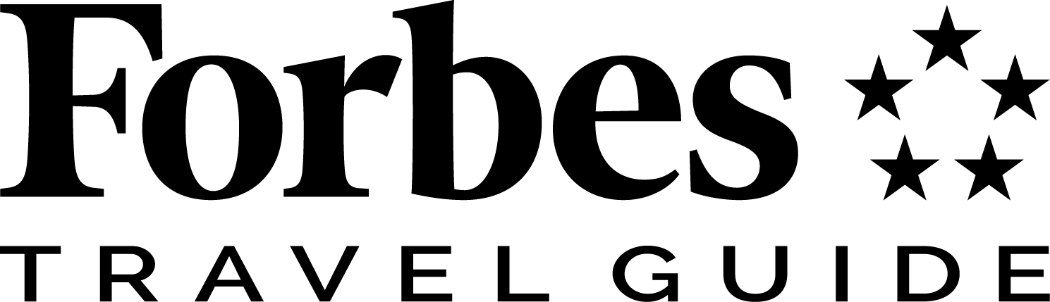 Forbes Travel Guide logo with stars.