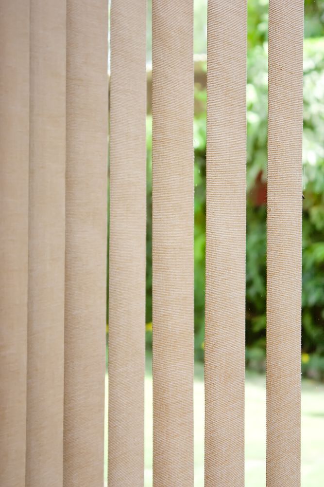 A Close Up Of Vertical Blinds On A Window — Ulladulla Blinds & Home Improvements In Ulladulla, NSW
