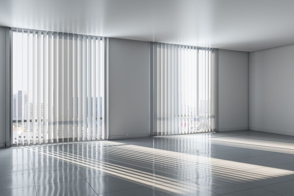 Sheer Vertical Blinds Casting Light In A Modern Room — Ulladulla Blinds & Home Improvements In Ulladulla, NSW
