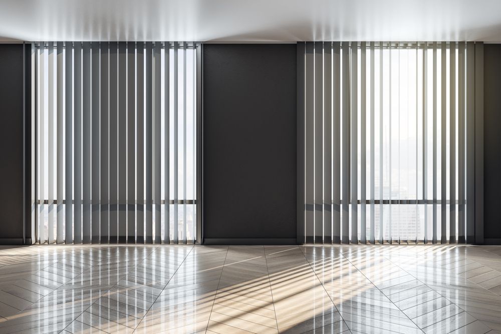 Two Large Windows With Vertical Blinds In A Bright Room — Ulladulla Blinds & Home Improvements In Ulladulla, NSW
