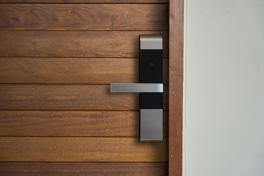 Modern Door With A Keyless Entry System And Handle — Ulladulla Blinds & Home Improvements In Ulladulla, NSW