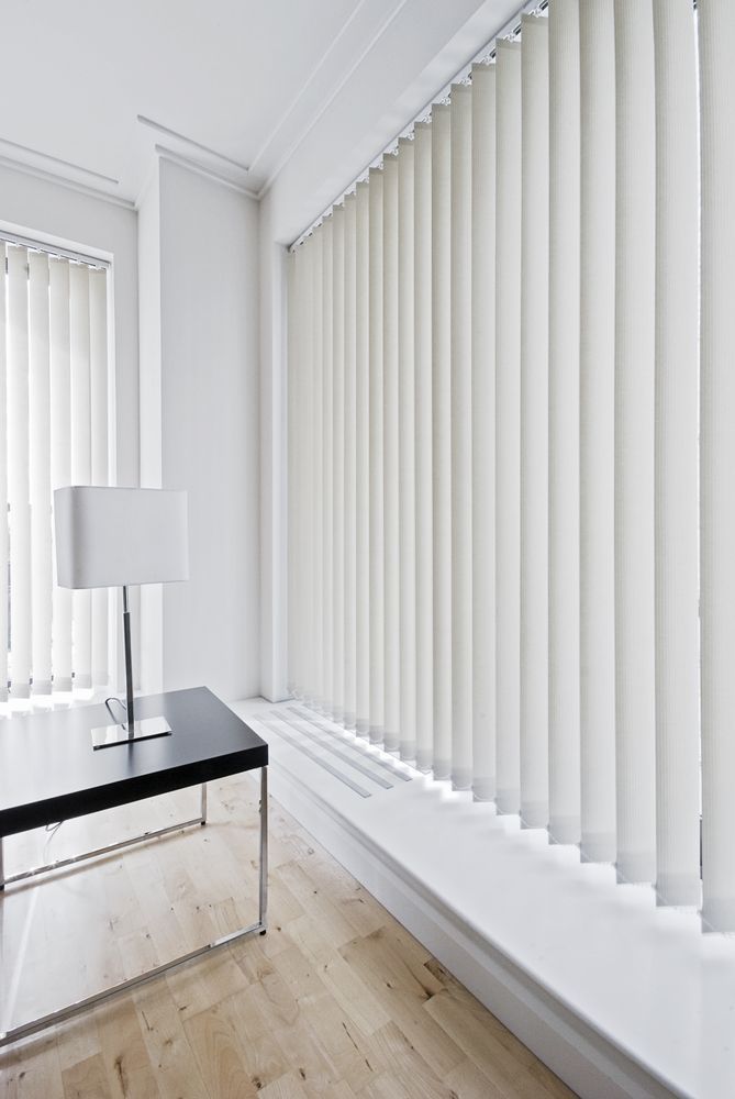 White Vertical Blinds In An Office Setting, Providing Privacy And Light Control — Ulladulla Blinds & Home Improvements In Ulladulla, NSW