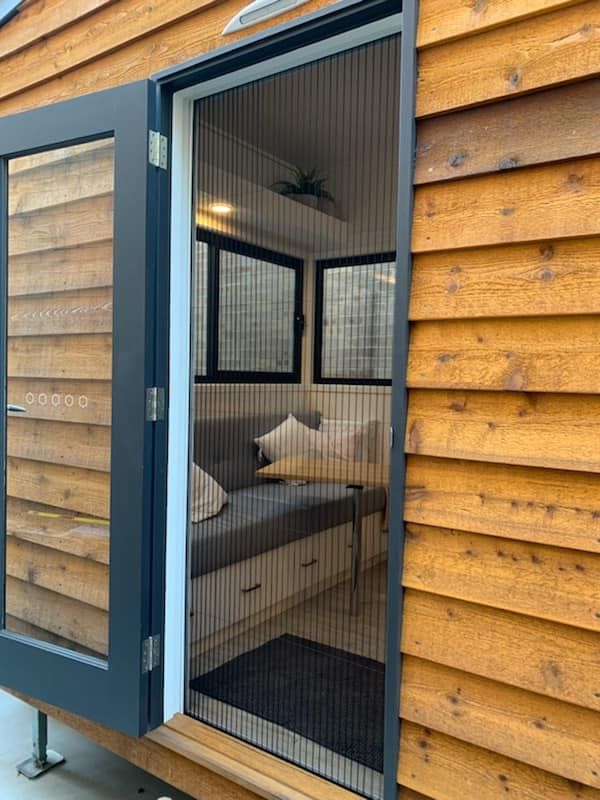 A Hinged Fly Screen Door, Open Position, On A Tiny House — Ulladulla Blinds & Home Improvements In Ulladulla, NSW