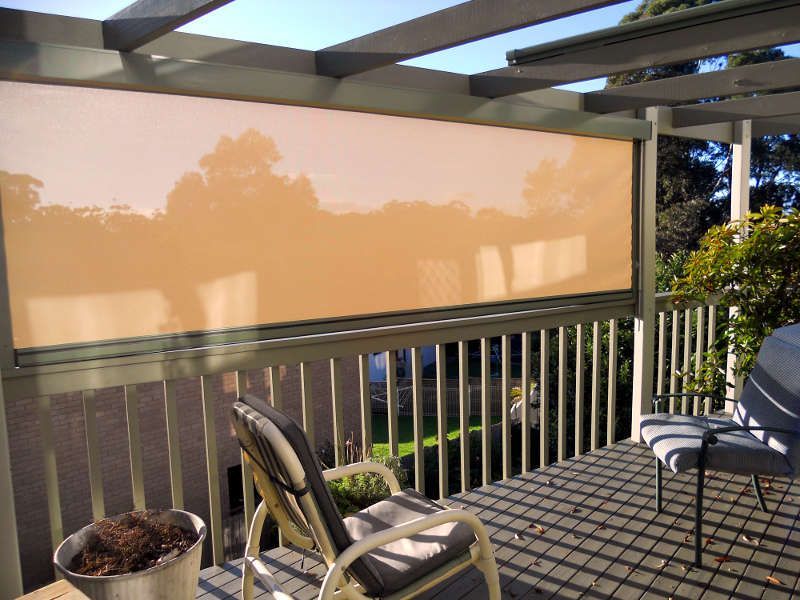 A Balcony With A Chair And A Potted Plant — Ulladulla Blinds & Home Improvements In St Georges Basin, NSW