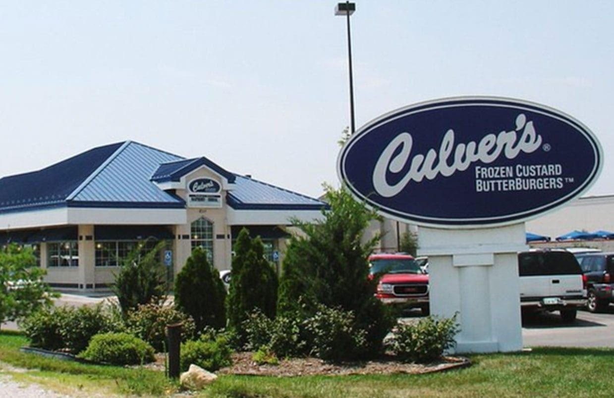 Culver’s restaurant sign and building exterior with blue roof and landscaping along the roadside