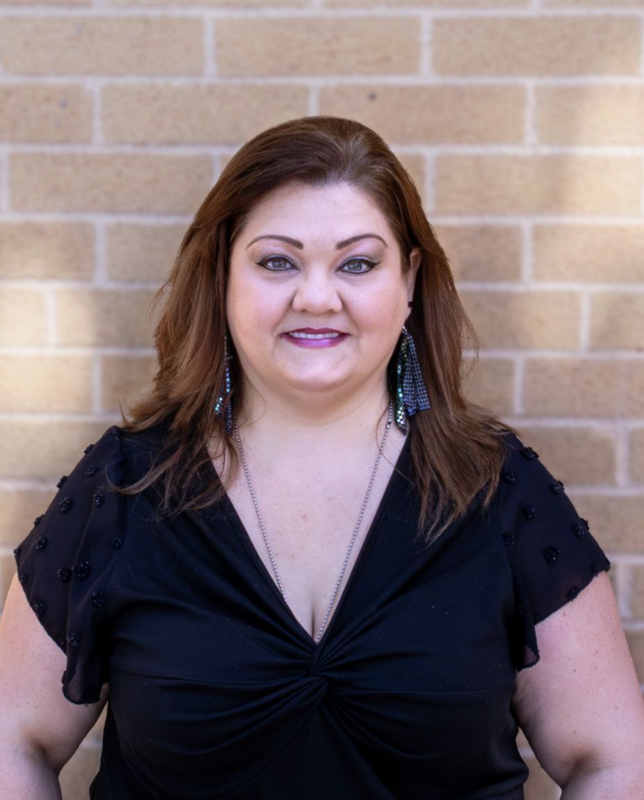 Portrait photography of Amy Sokeland, tan brick background