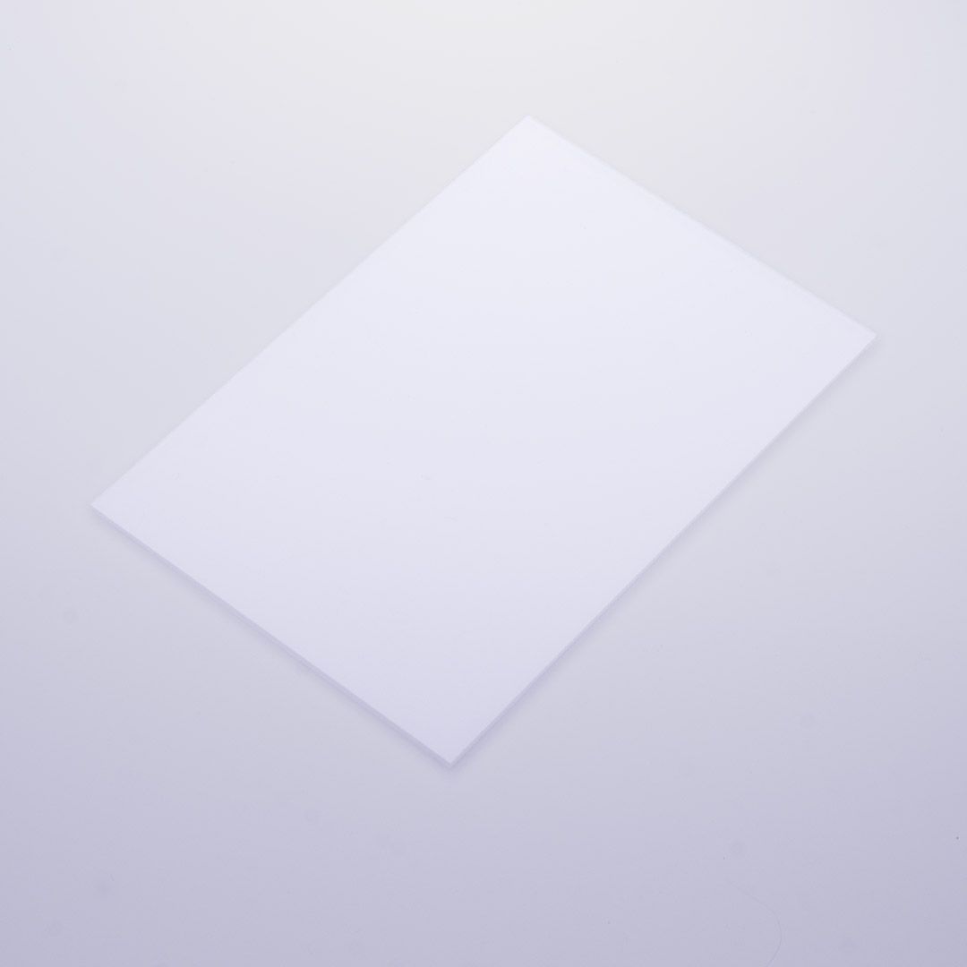 A close up of a white plast surface with a matte finish.