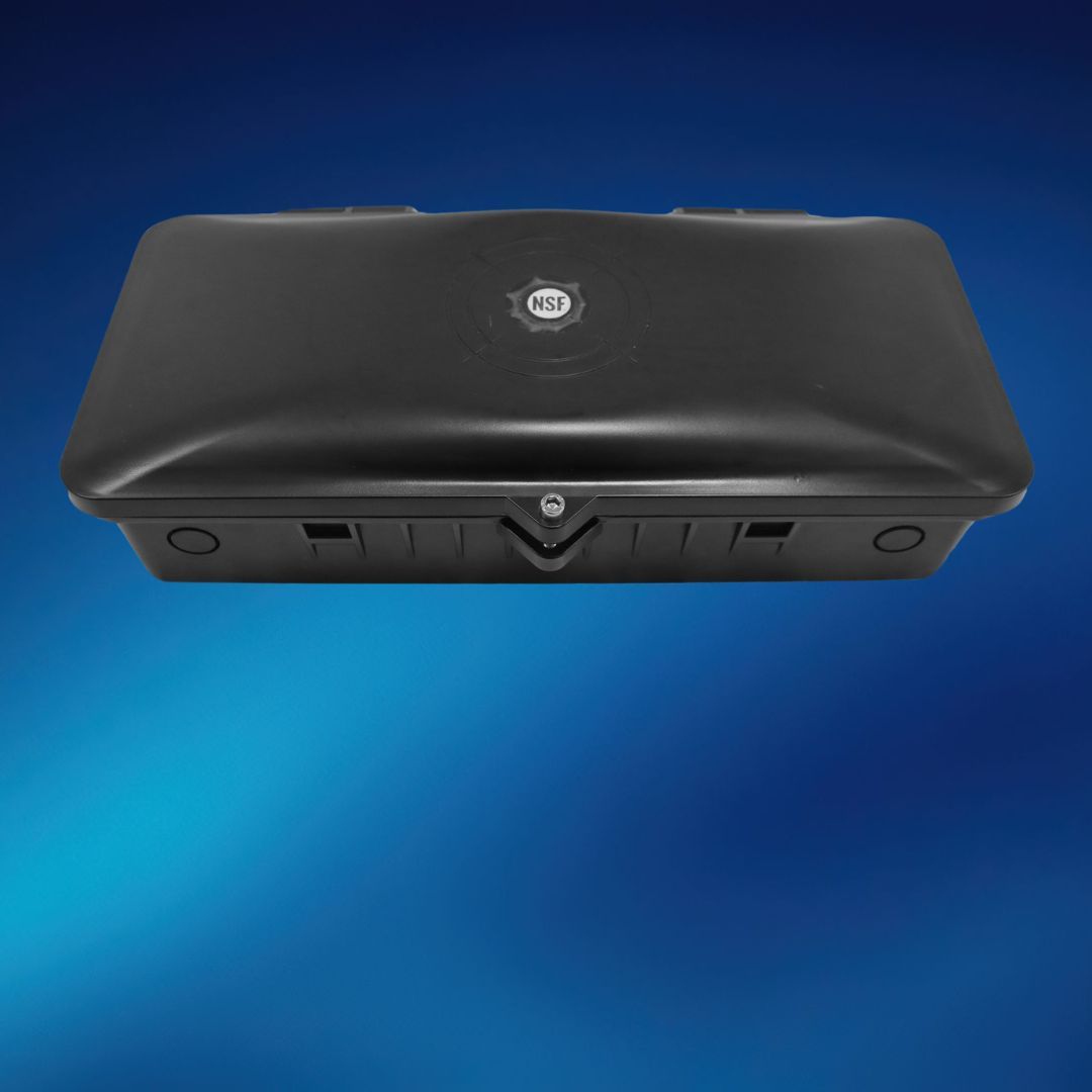 A black box is sitting on top of a blue surface.